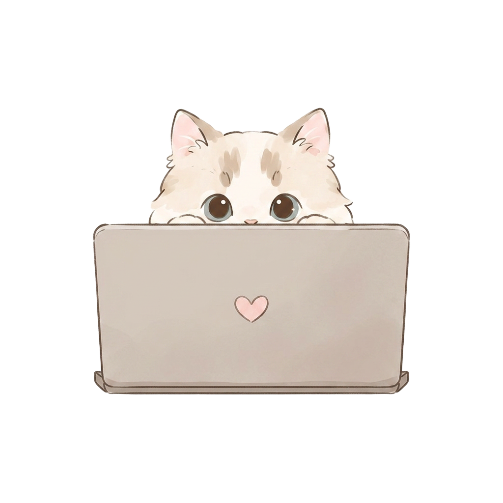 Puck the Ragdoll peeking over a laptop
